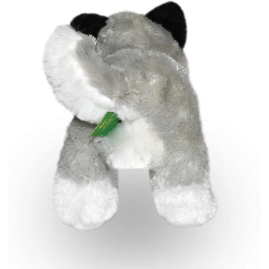 Plush toy elephant with a green tag on a white background