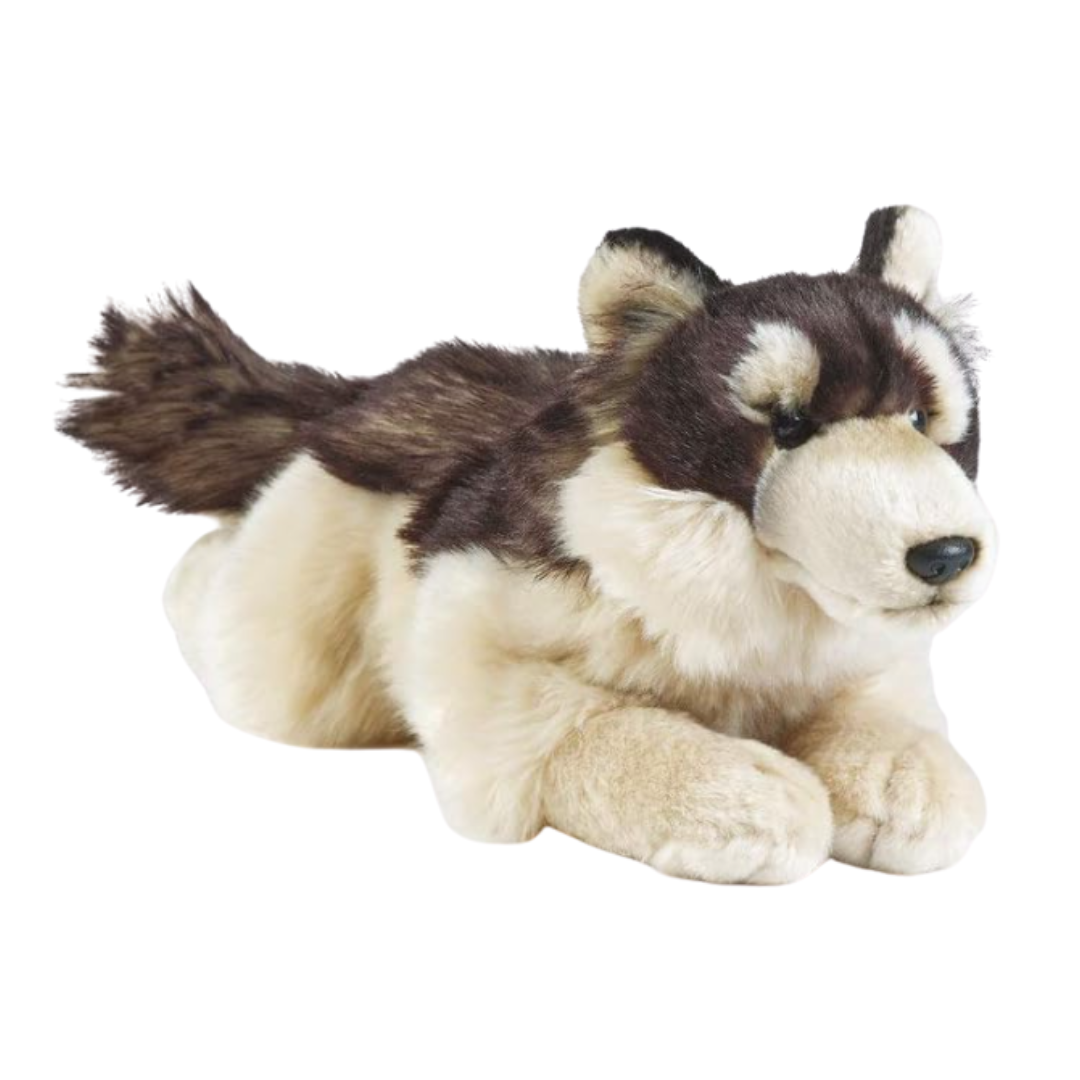 Plush toy husky lying down on a white background