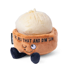 Plush toy shaped like a dim sum bun with a smiling face on a white background