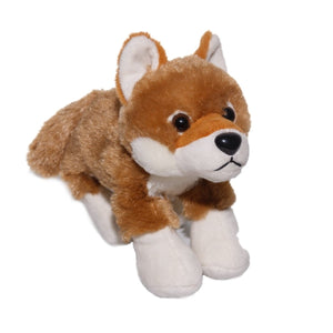 Plush toy fox with brown, white, and black fur on a white background