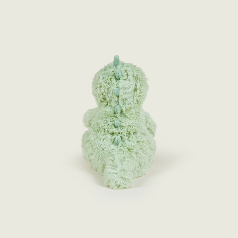 A mint green plush dinosaur toy shown from the back, featuring textured shaggy fabric and a matching spine detail, set against a solid off-white background.