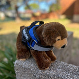 Grizzly Bear plushie wearing a blue emotional support vest - emotional support stuffed animal - side view