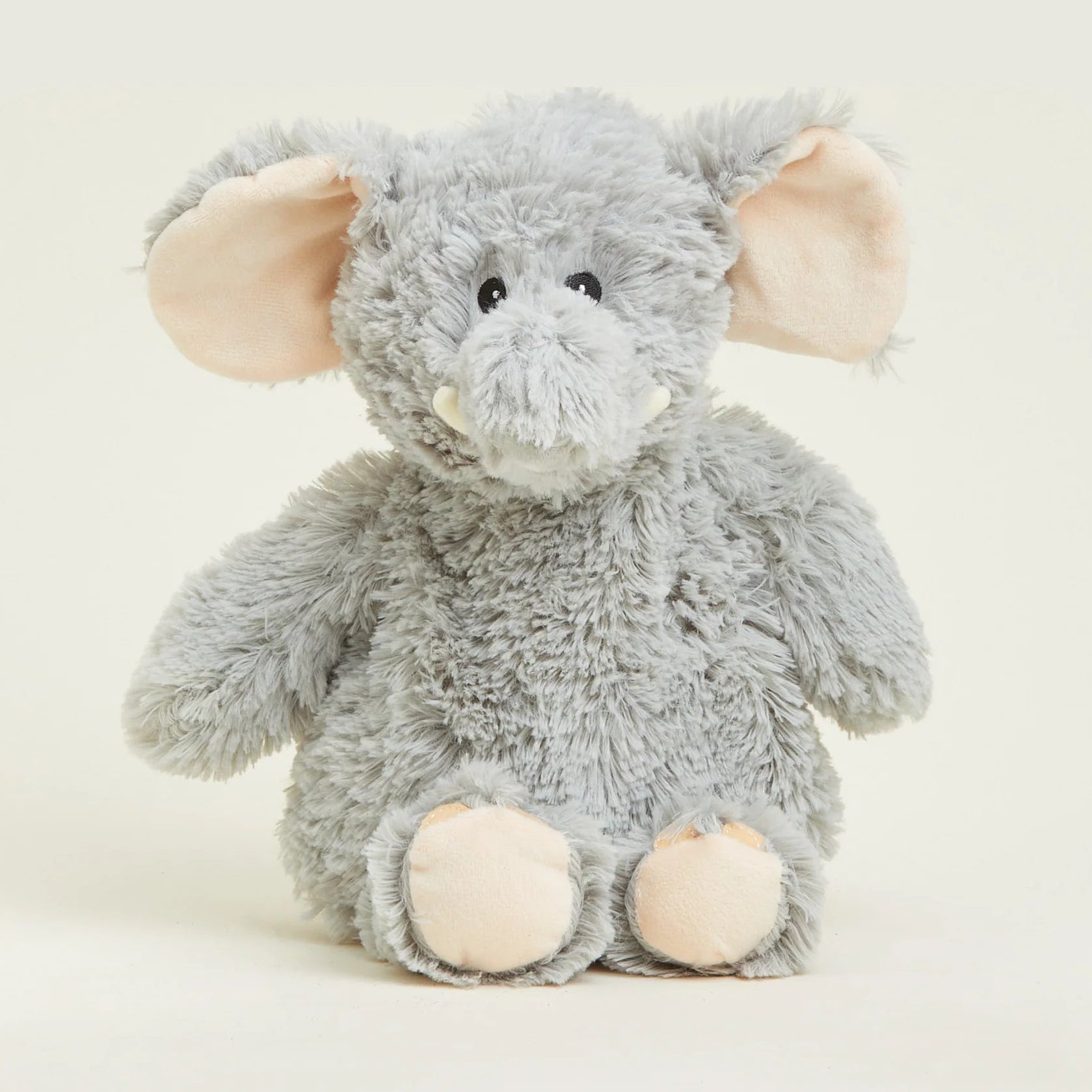 Plush elephant toy on a white background