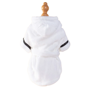 White robe with black trim on a wooden hanger against a white background